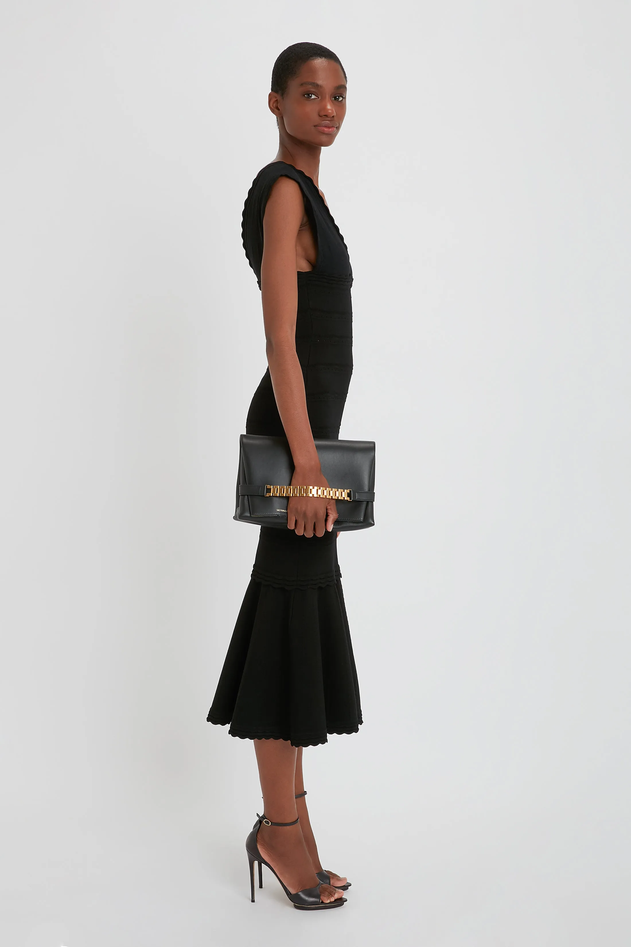 Chain Pouch Bag With Strap In Black Leather